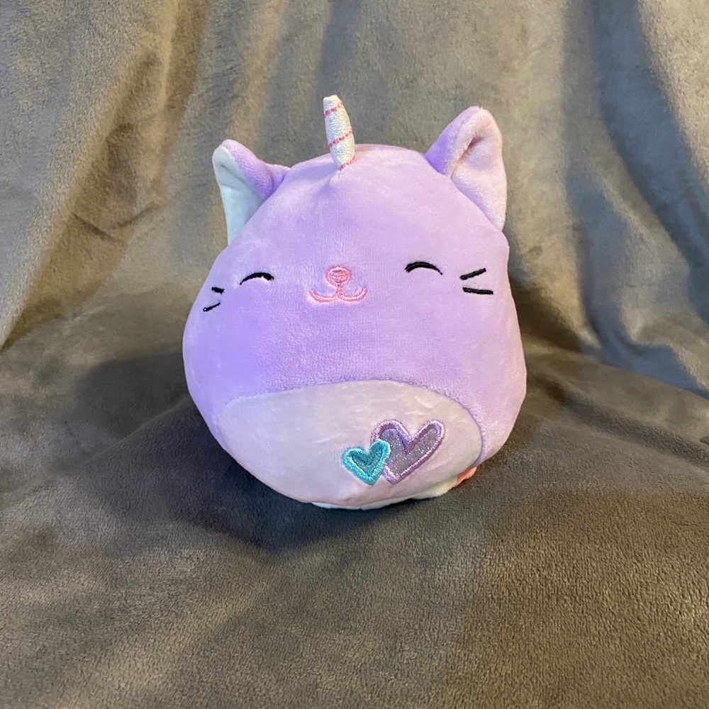 Small flip squishmallow unicorn plush.